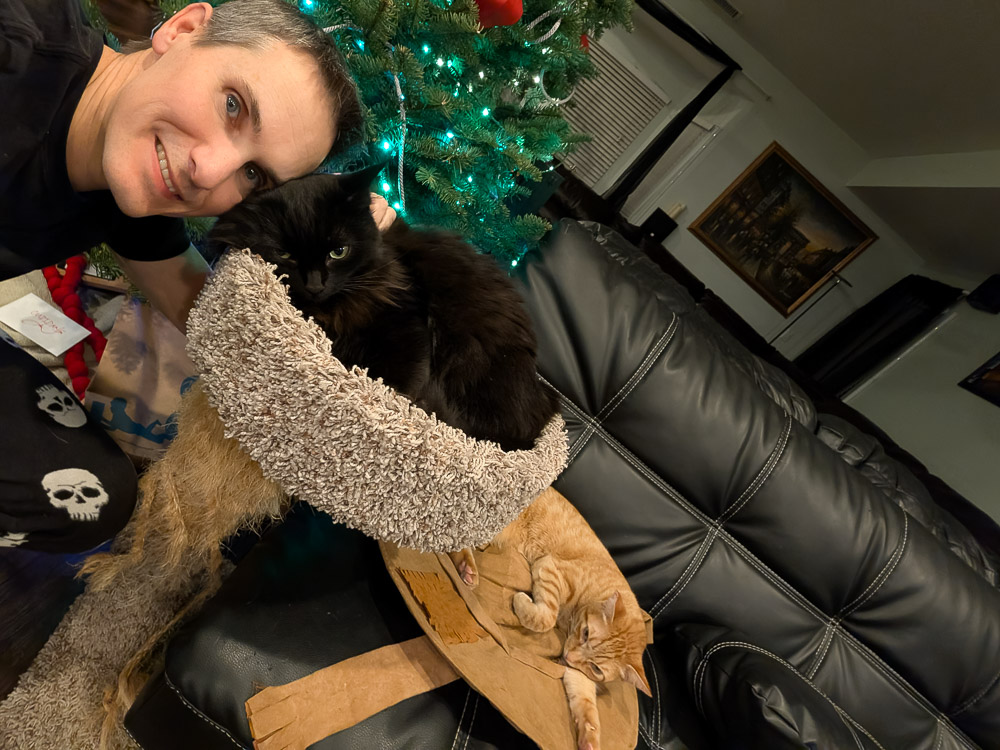 Robby with Poe and Travis, his two indoor cats and the real coding partners behind Trovvy